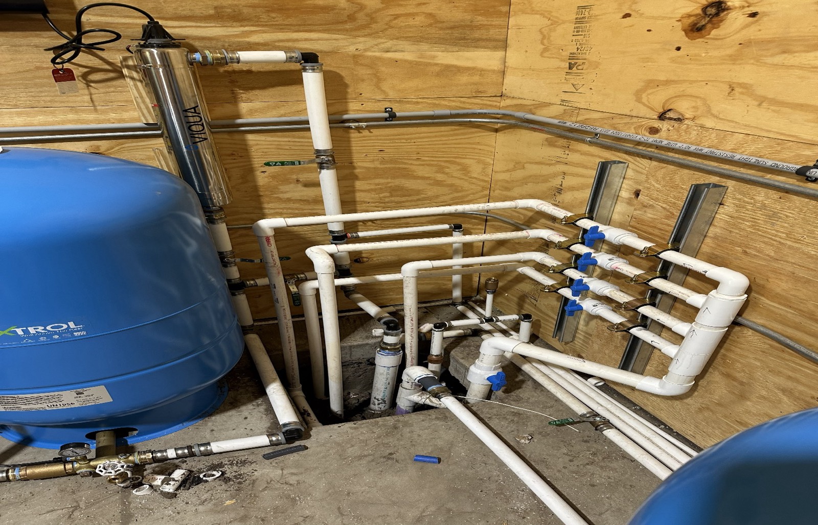 UV disinfection unit and pressure system with PVC manifold.